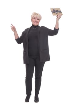 full-length. Mature business woman with a gift box. isolated on a white background.
