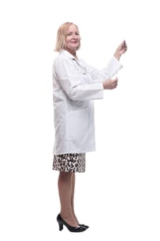 in full growth.female doctor looking at an x-ray. isolated on a white background.