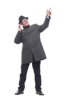 in full growth. intelligent man with a smartphone. isolated on a white background.