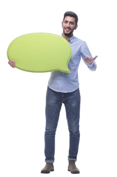 in full growth. smiling young man with a speech bubble . isolated on a white background.