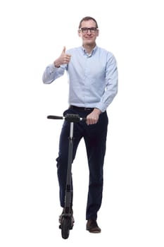 in full growth. casual man with electric scooter showing OK gesture. isolated on white