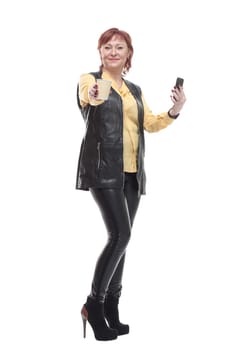 mature woman with smartphone and coffee to take away . isolated on a white background.