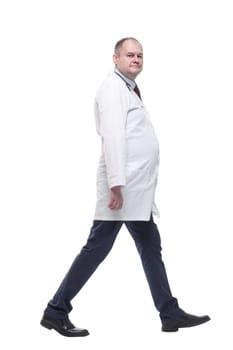 rear view. qualified male paramedic striding forward . isolated on a white background.