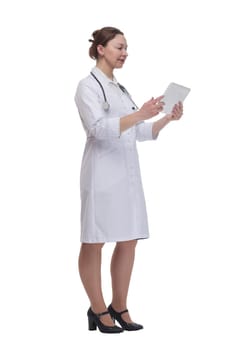 in full growth.female doctor with a digital tablet. isolated on a white background.