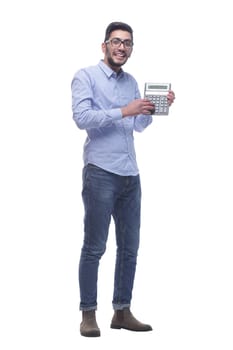 in full growth. smart young man with a calculator . isolated on a white background.