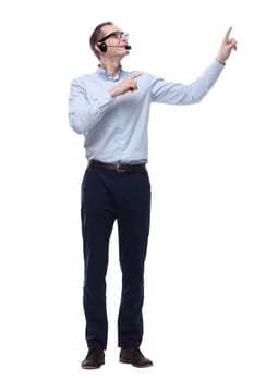 in full growth. friendly man in a headset. isolated on a white background