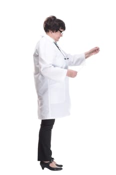 in full growth. senior female doctor with an x-ray. isolated on a white background.