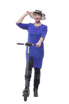 Front view of young woman in dress and hat on kick scooter isolated on white background