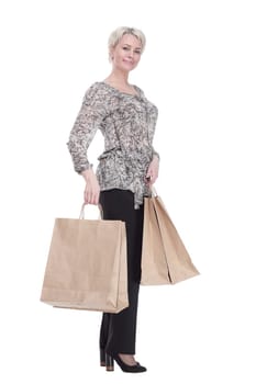 in full growth. elegant young woman with shopping bags . isolated on a white background.