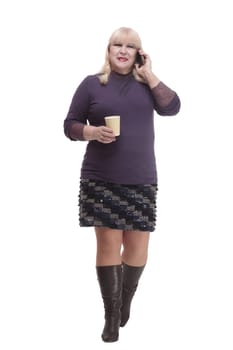 casual mature woman with smartphone and coffee to takeaway . isolated on a white background.