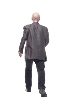in full growth. Executive business man striding forward . isolated on a white background.
