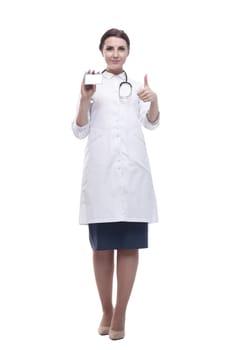 in full growth. female doctor showing her visiting card. isolated on a white background.