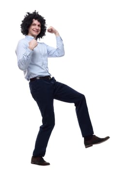 in full growth. happy curly-haired man . isolated on a white background