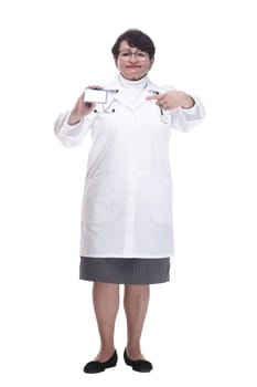 in full growth. senior female medic showing her visiting card. isolated on a white background.