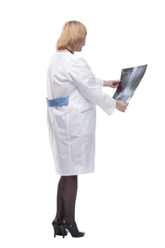 female doctor looking at a chest x-ray. isolated on a white background.