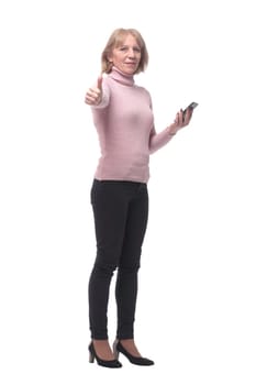 Side view of a casual woman texting on her phone, isolated on a white background