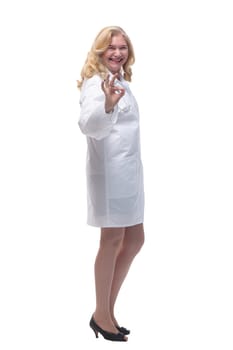 side view . fun female medic looking at you . isolated on white background.