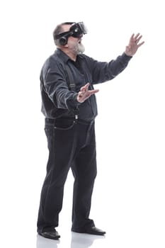 full- length . modern adult male in a virtual reality helmet. isolated on a white background