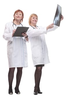 in full growth. two female doctors with x-rays. isolated on a white background.