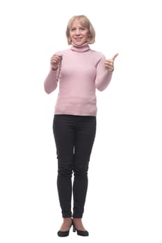 Friendly caucasian smiling woman holding keys wearing jeans and sweater