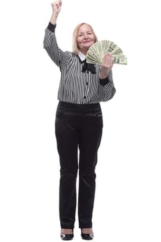 in full growth. attractive business woman with a fan of banknotes. isolated on a white background.