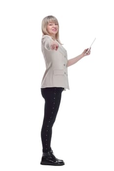 side view. attractive blonde woman using her digital tablet . isolated on a white background.