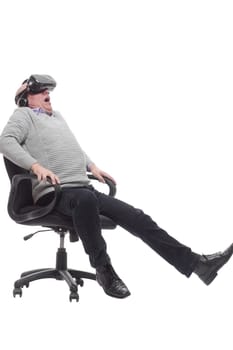 in full growth. smiling man in virtual reality glasses. isolated on a white background.