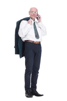 business man with a jacket over his shoulder reading a message on his smartphone. isolated on a white background.