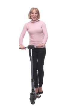 Full length portrait of a woman riding a scooter isolated on white background