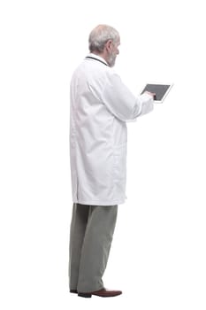 elderly competent doctor with a digital tablet. isolated on a white background.