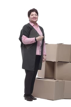 in full growth. Mature woman making an entry in the clipboard. isolated on a white background