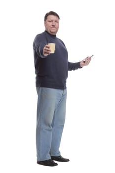 casual mature man with smartphone and takeaway coffee .isolated on a white background.
