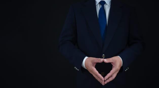 businessman standing on dark  background. business concept. suit.