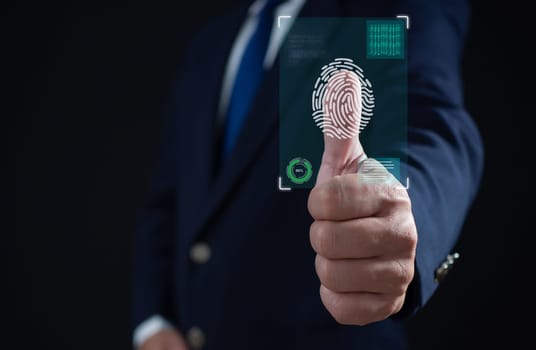 Businessman scan fingerprint biometric identity and approval. Secure access granted by valid fingerprint scan, Business Technology Safety Internet Network Concept, Business Technology Safety Internet Network Concept.
