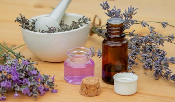 lavender essential oil, on a wooden background. Selective focus. Nature
