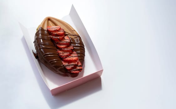 Closeup Genital Vagina Shaped Waffle With Berries and Dark Chocolate On Table, Gray Background. Festival Street Food, Cookie. Horizontal Plane, Copy Space for Text. High quality photo