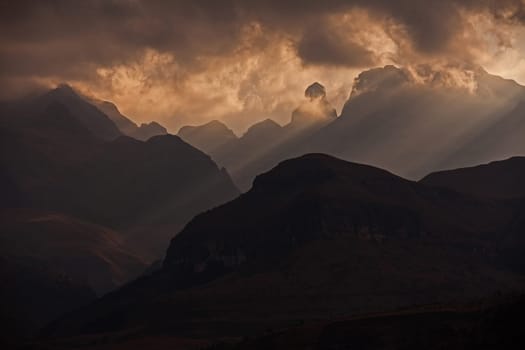 A stormy sunset at Cathedral Peak in the Drakensberg Mountains. KwaZulu-Natal Province, South Africa