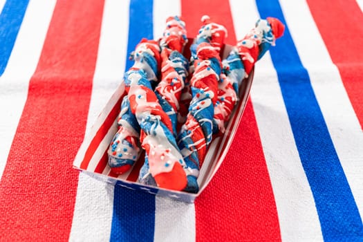 Patriotic cinnamon twists drizzled with a white glaze and decorated with star sprinkles.