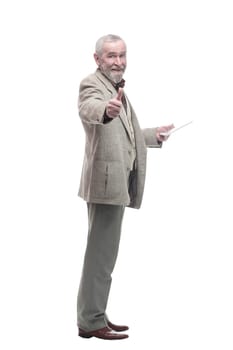 in full growth. elderly business man with a digital tablet. isolated on a white background.