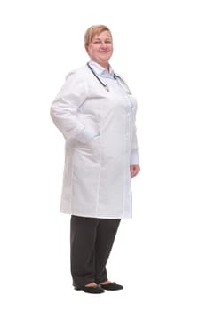 Side view of smiling female doctor with hands in her pockets against a white background