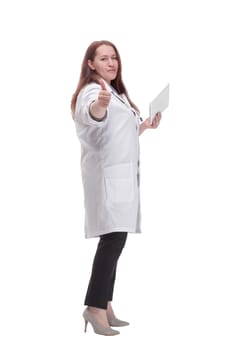 full-length. mature female doctor with a digital tablet. isolated on a white background.