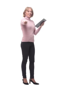 Full length portrait of smiling business woman pointing on blank clipboard isolated over white background