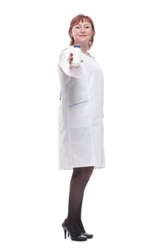 in full growth. competent female doctor with sanitizer . isolated on a white background.