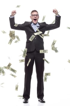 in full growth. happy young businessman with cash banknotes. isolated on a white background.