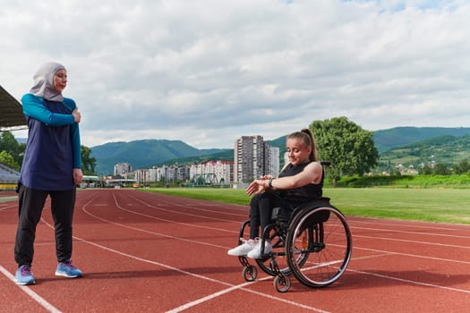 A Muslim woman wearing a burqa supports her friend with disability in a wheelchair as they train together on a marathon course