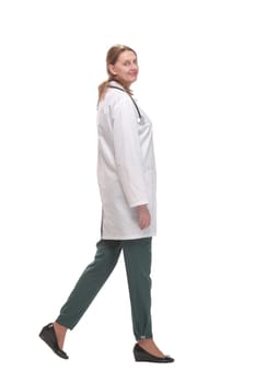 Full length portrait of medical doctor woman going sideways. Concept of medical help