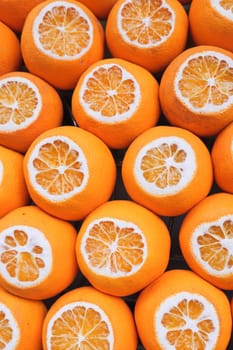 close up of slice of orange fruit in a bowl .