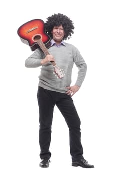 in full growth. cheerful man with a guitar. isolated on a white background.