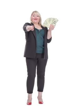 in full growth. attractive woman with a wad of banknotes. isolated on a white background.