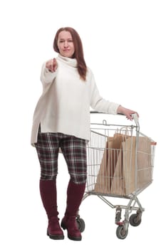 full-length. casual woman with shopping cart .isolated on a white background.